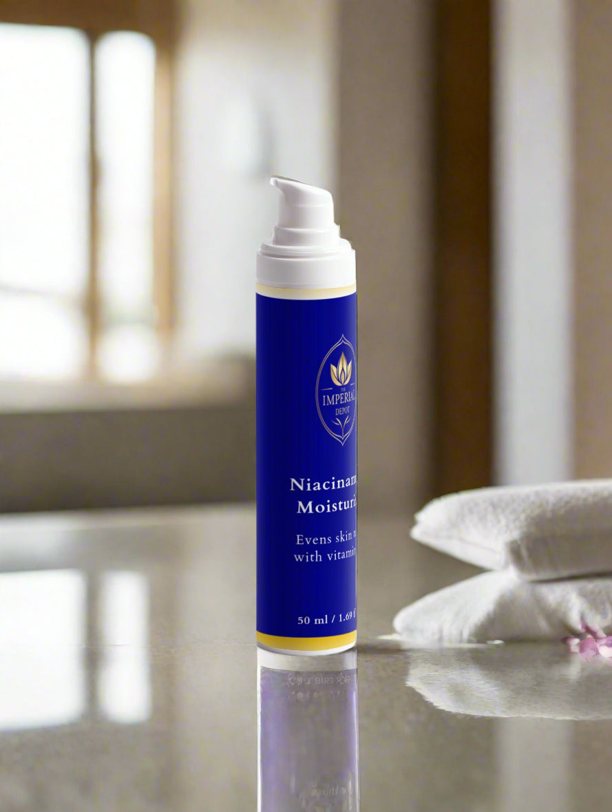 Blue skincare bottle with white cap on a light gray background