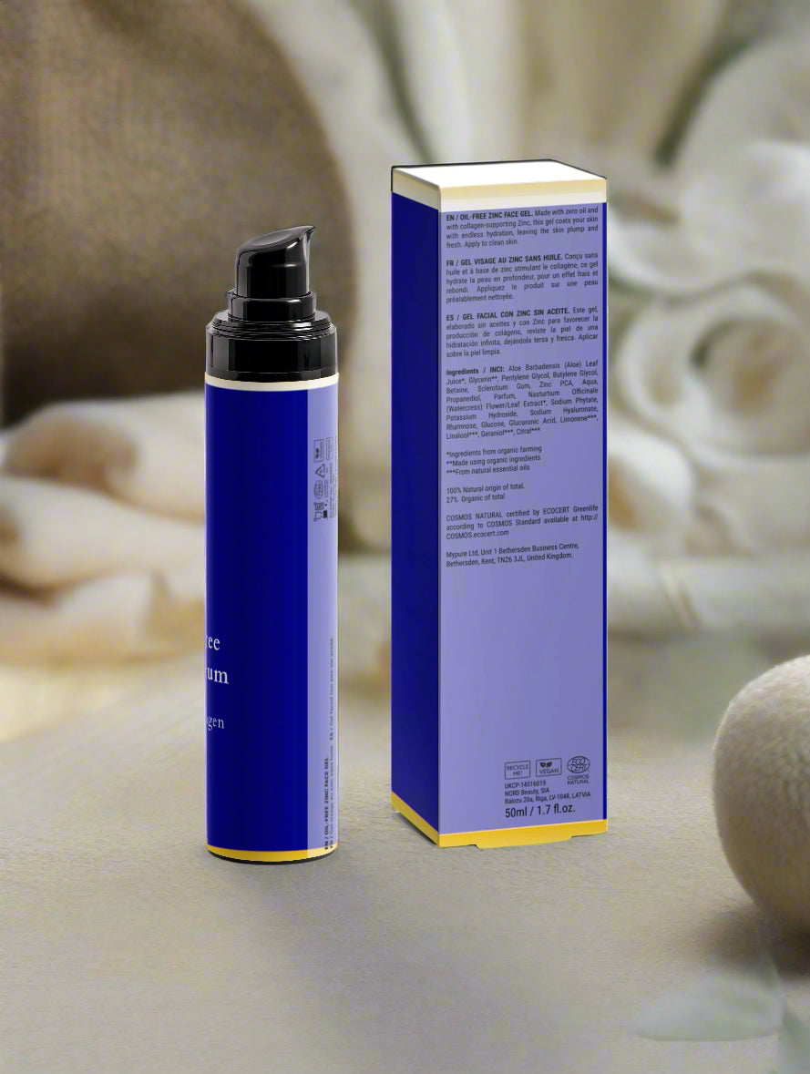 Blue skincare product bottle and box on a neutral background