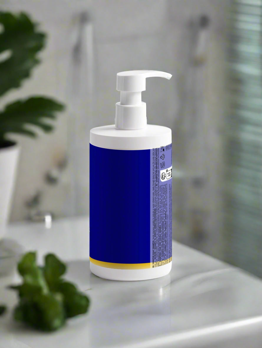 Blue bottle with white pump on a bathroom counter