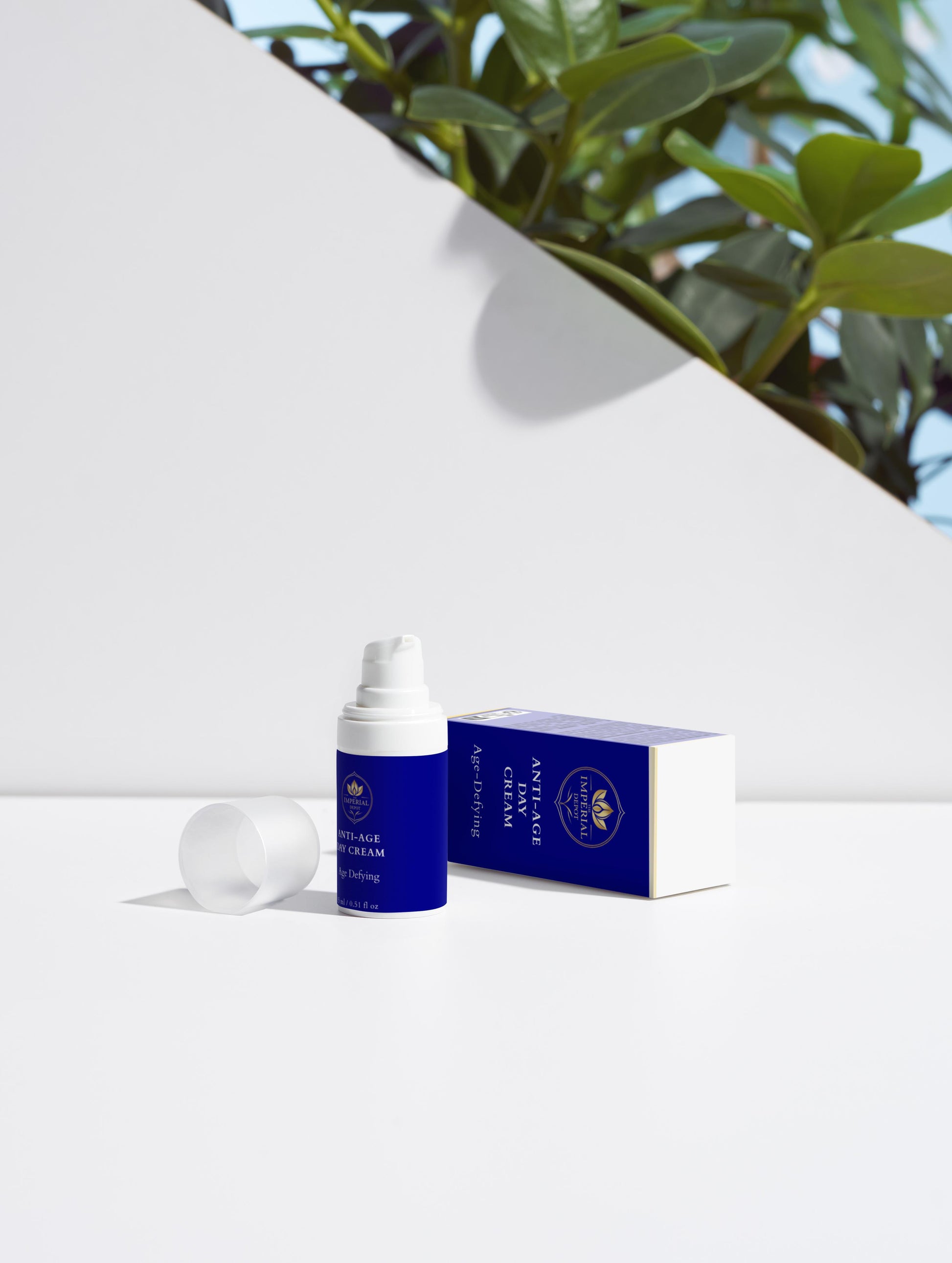 Blue skincare product with white cap on a white background