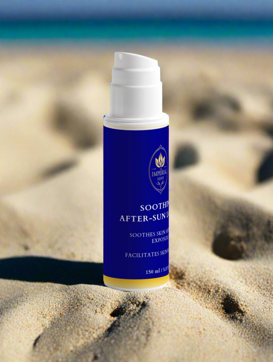 Bottle of soothing after-sun lotion on sand with blurred beach background