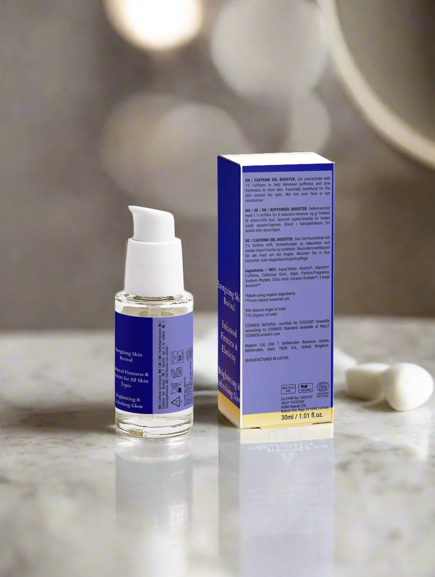 Skincare serum bottle with packaging on a light gray background