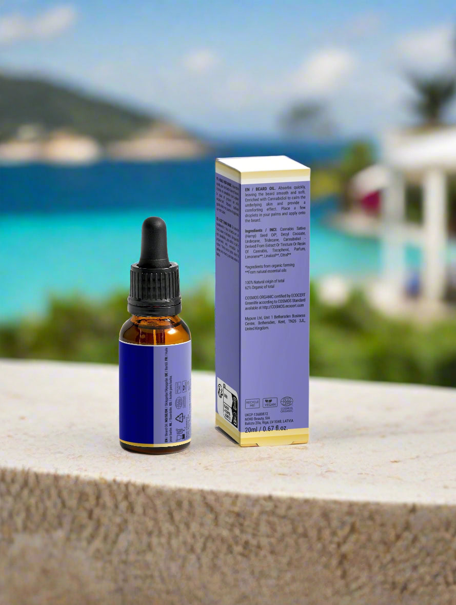 Bottle and box with dropper on a ledge with a scenic background
