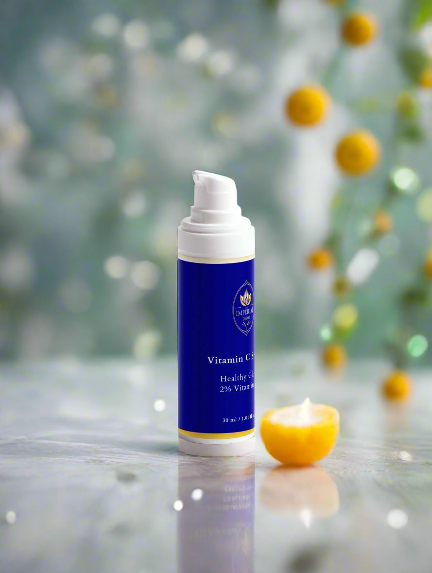 Blue skincare product with white pump on a reflective surface with blurred natural background